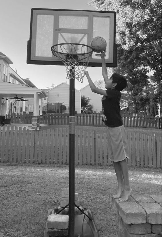 Kid playing basketball