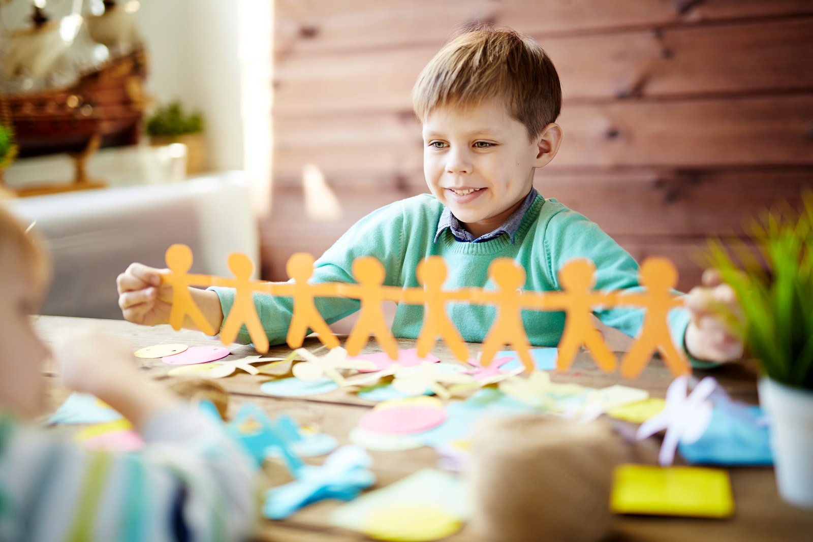 Child Using Paper School and Community for Children with Autism | Innocent Bee